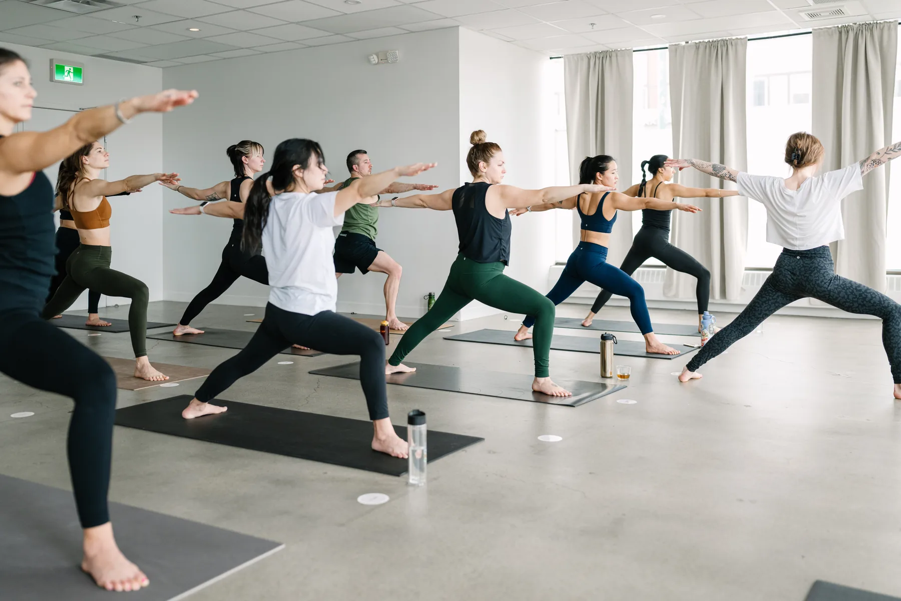 Students practising together in a Yogalife flow class.