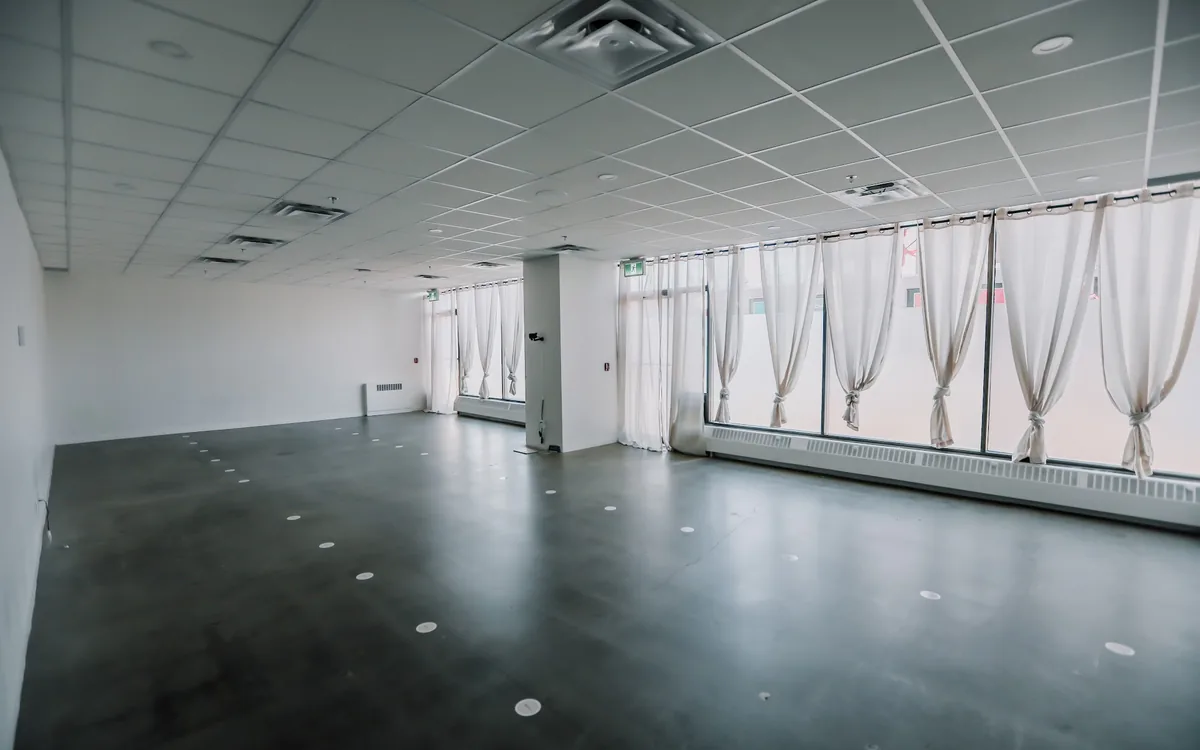 The bright, open 124 Street practice room with large windows.