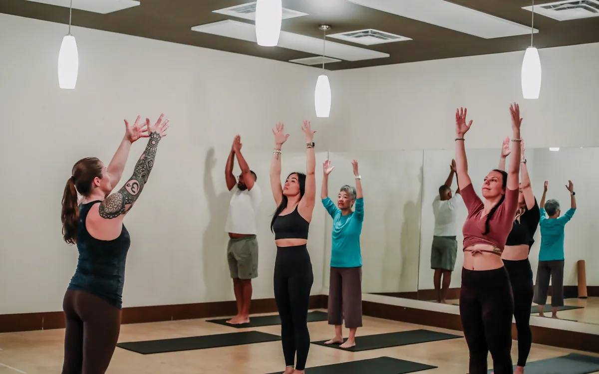A group class in progress in the warm-wood South Edmonton studio room.