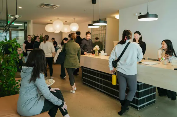 Students gathered at the front desk for coffee and matcha after class.